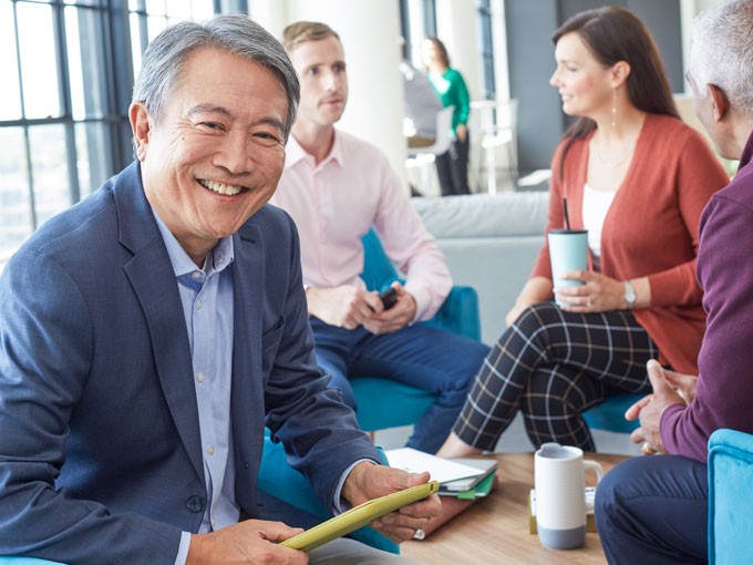 Smiling businessman in meeting