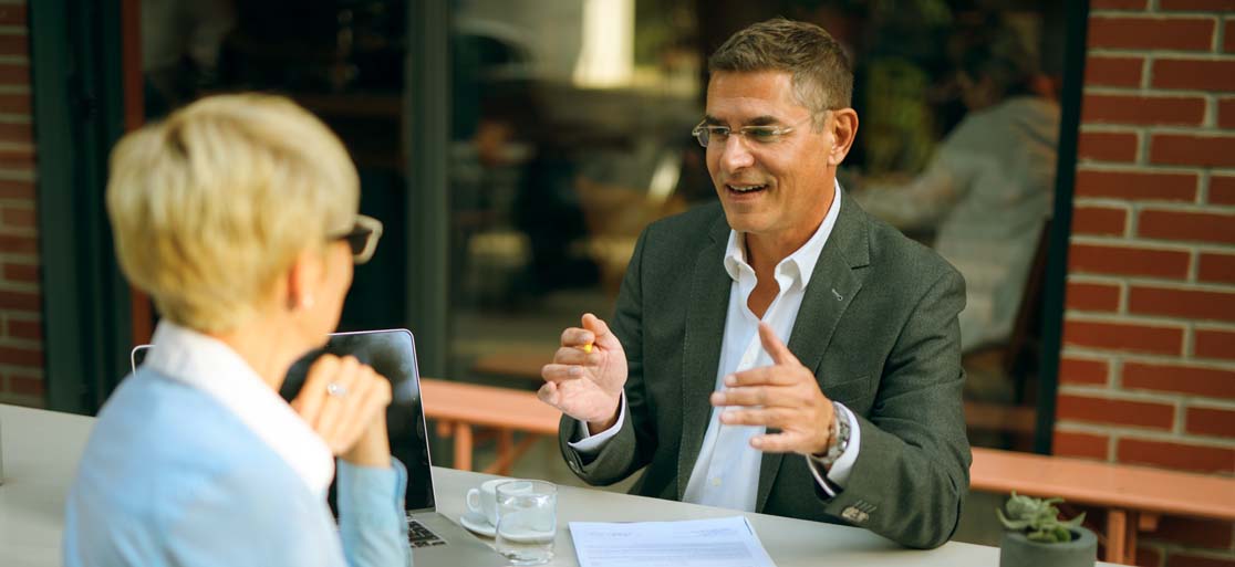 Business man talking to a client