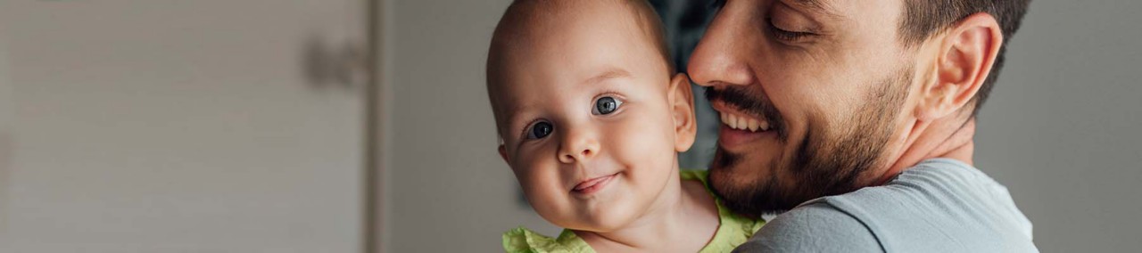 Father holding baby girl