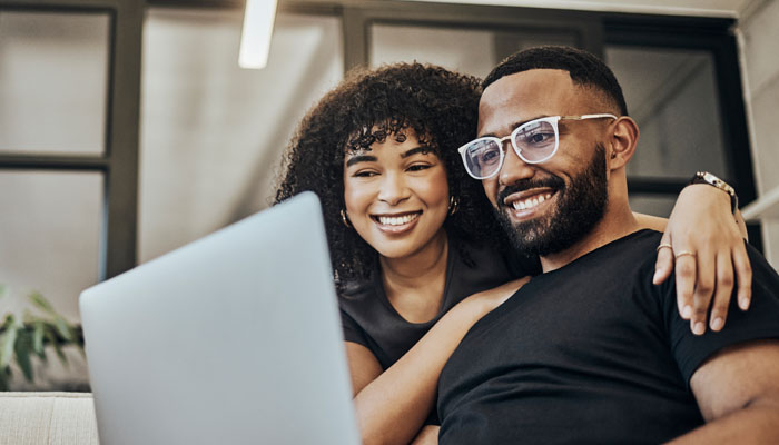 Young couple looking at a laptop