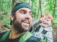 Father and young son hiking