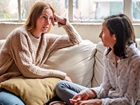 Mother having a serious talk with daughter