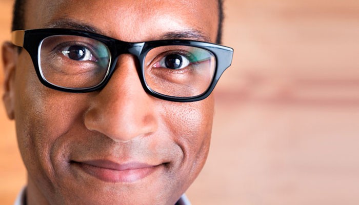 Happy African-American male with glasses