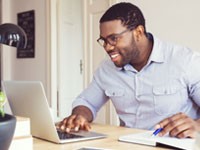 Man working at desk in home office